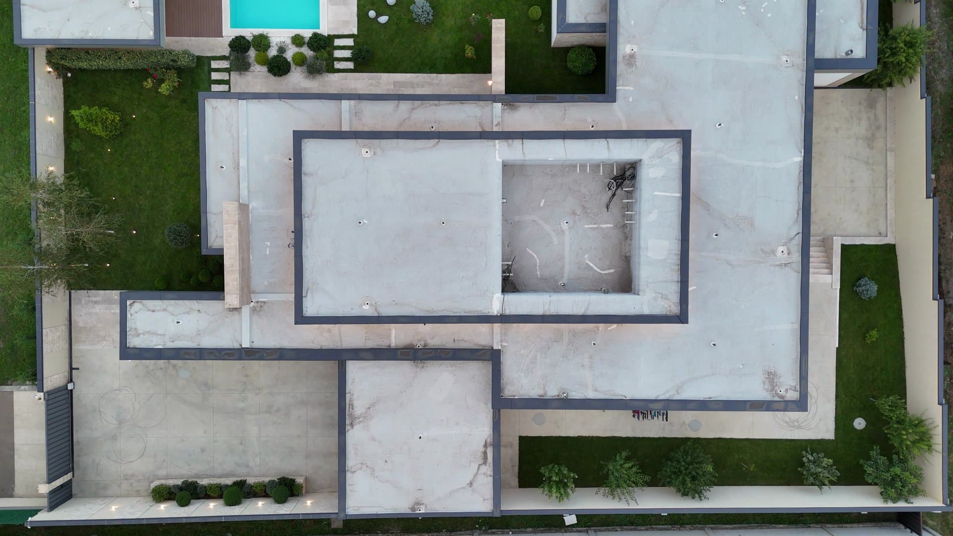 The plot from overhead, from the roofs of the house to the pool.