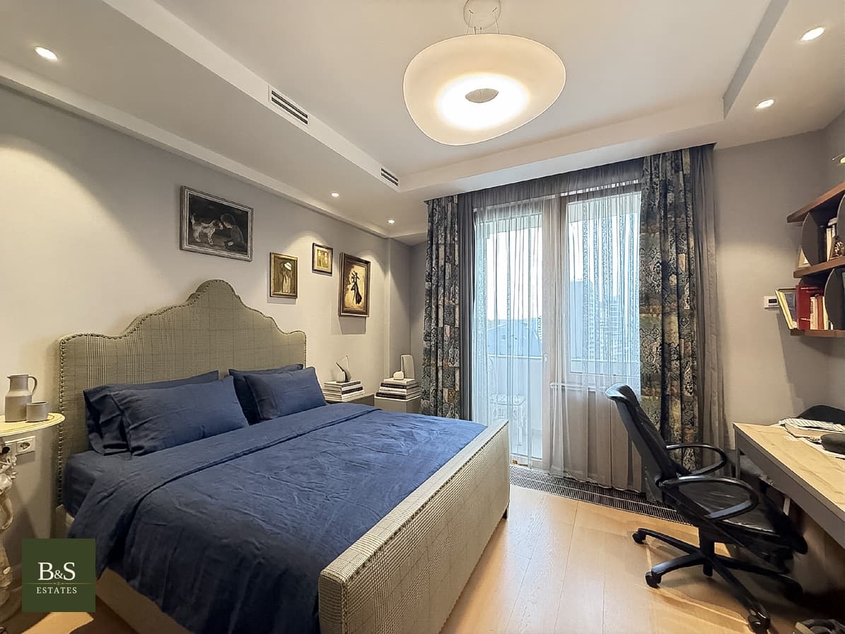 A bedroom with its own desk.