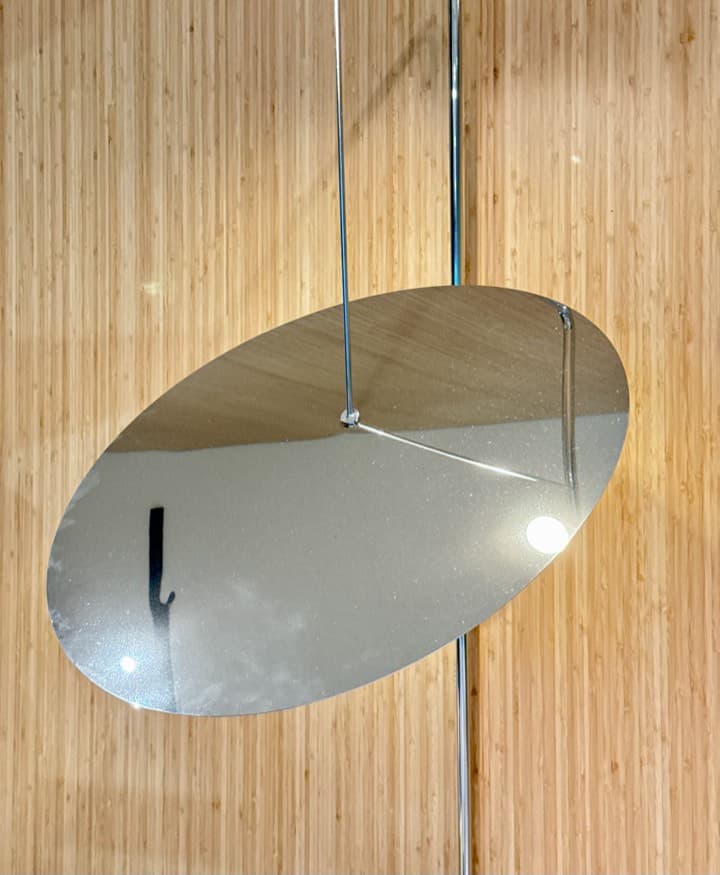 Mirror-polished chrome disc.