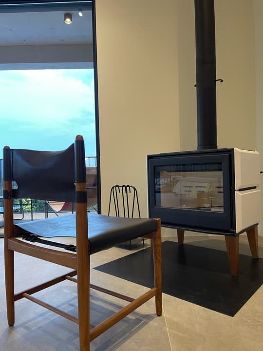 Stove and leather chair.