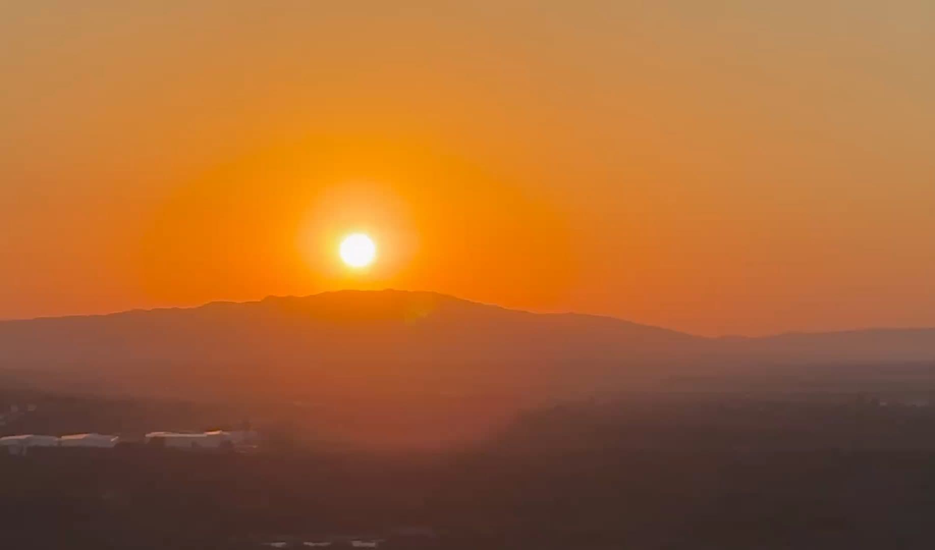 Sunset over the hills, seen from the house